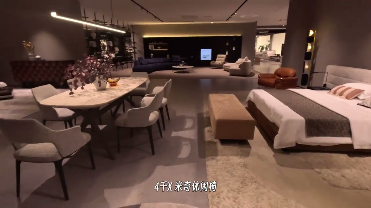 Furniture showroom floor with dining furniture and a bedroom display