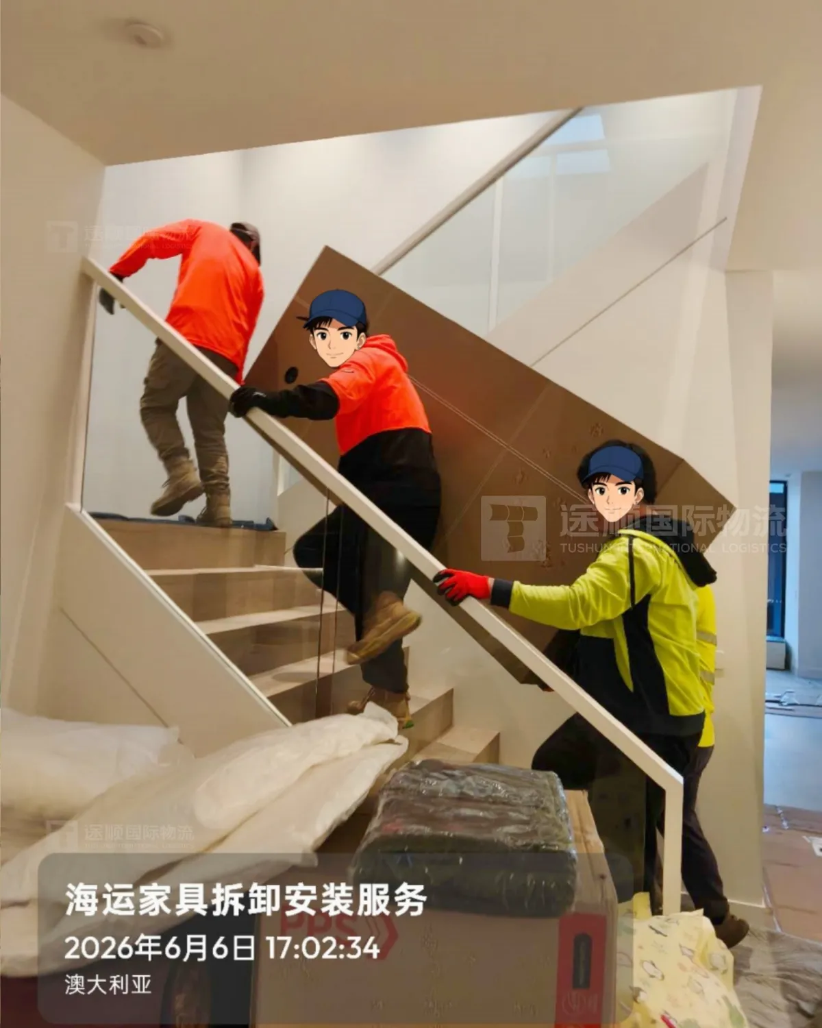 Crew carrying a crated piece up a staircase