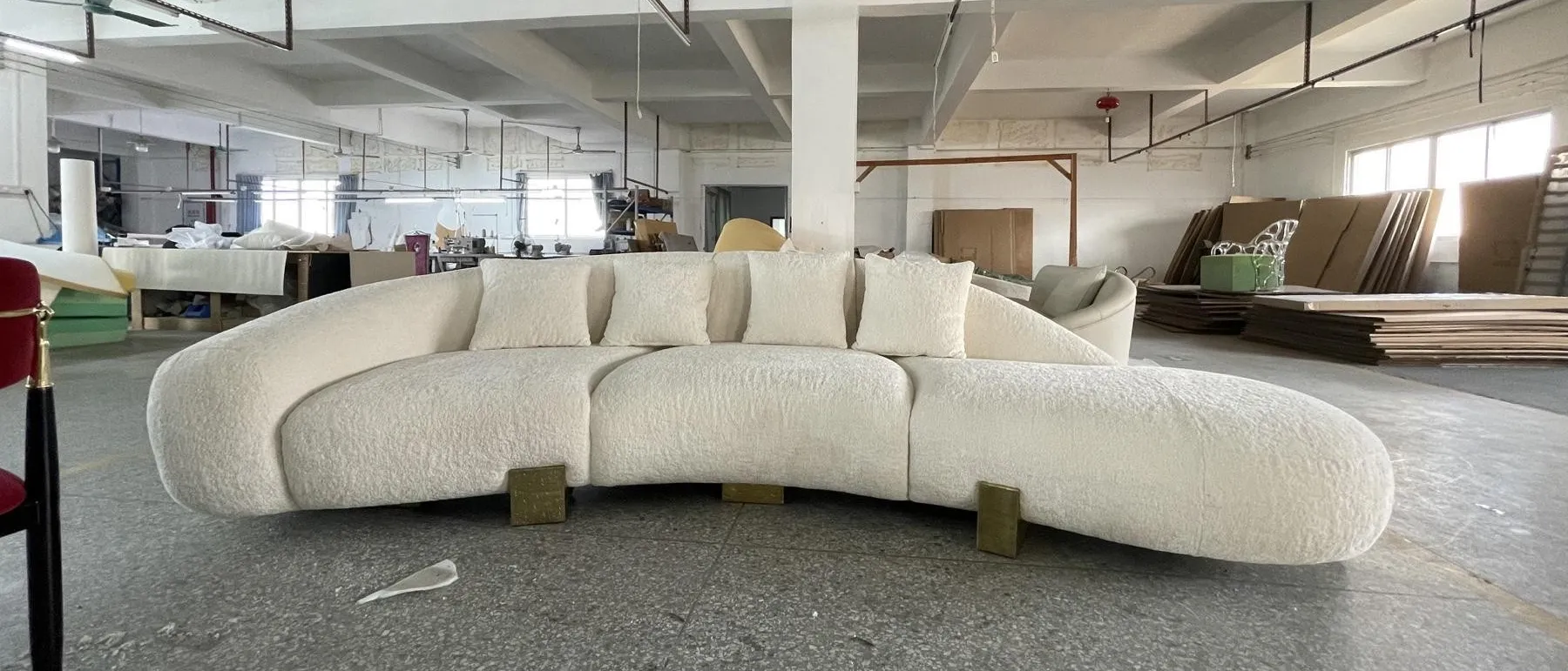 Curved modular sofa finished on a factory floor in Foshan