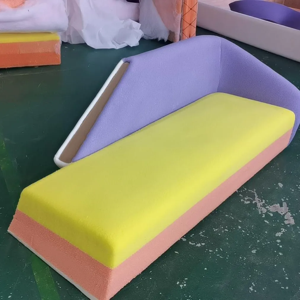 Foam layers cut and colour-blocked before upholstery
