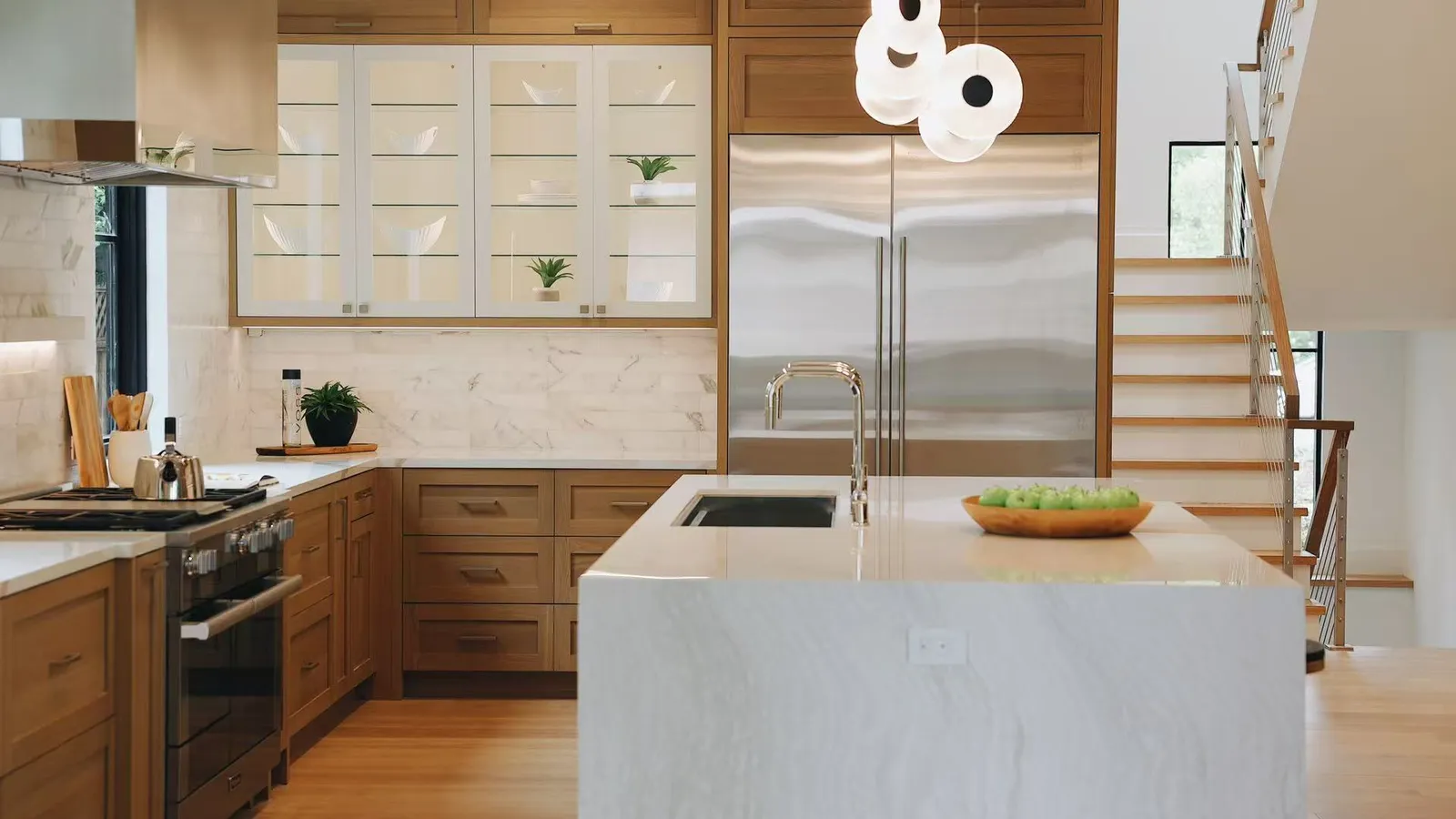 Kitchen with oak cabinetry and marble island, Menlo Park residence