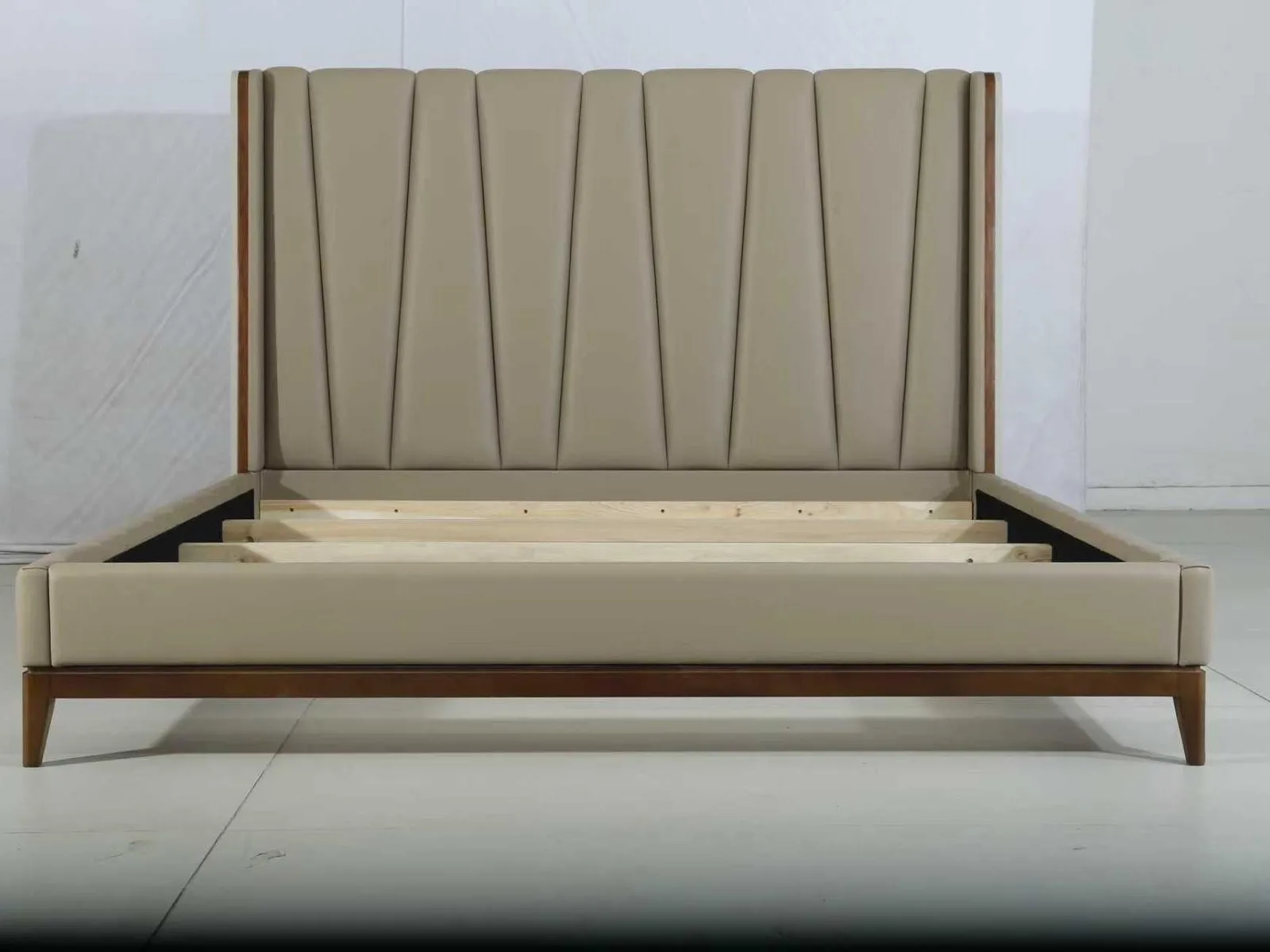 Upholstered bed frame finished at the factory