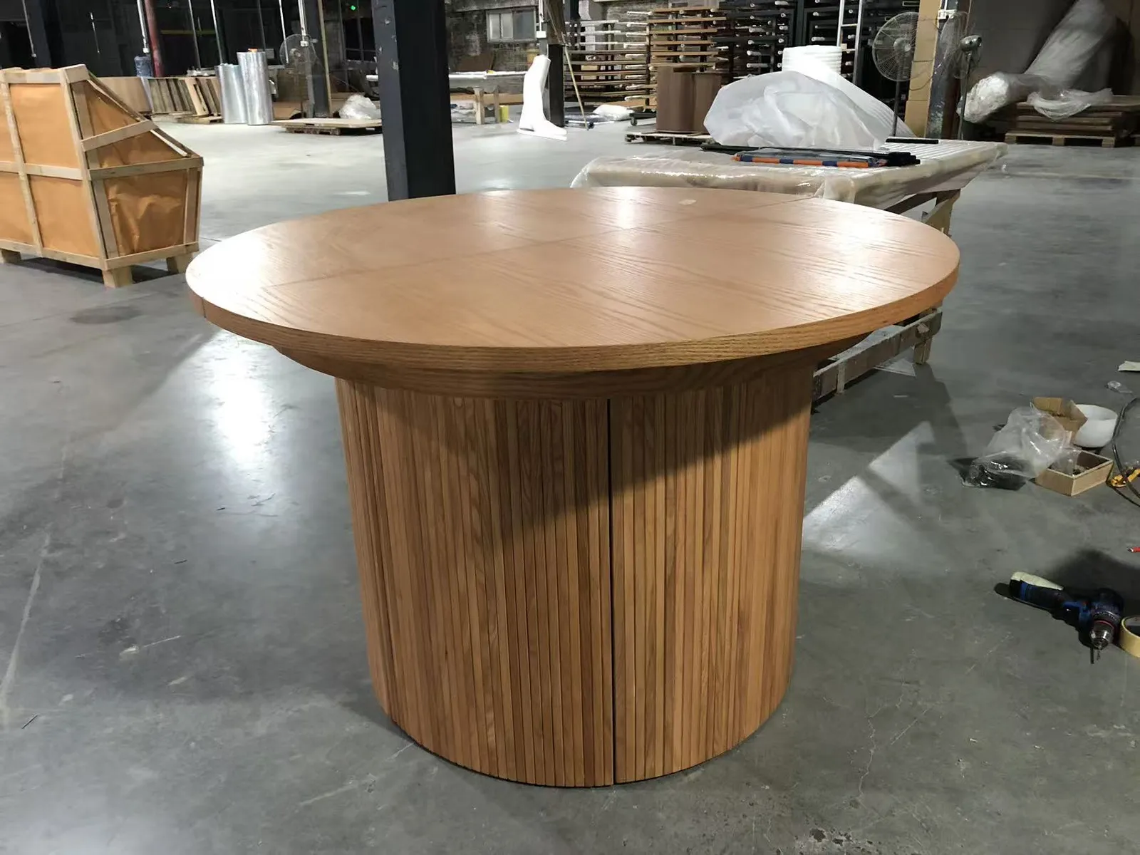 Extending dining table closed, on the factory floor