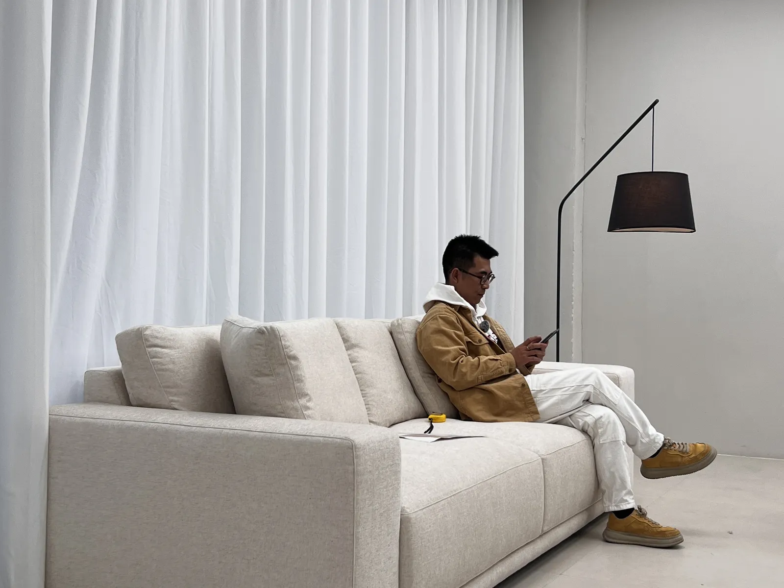 Sit test on a finished sofa in the inspection studio
