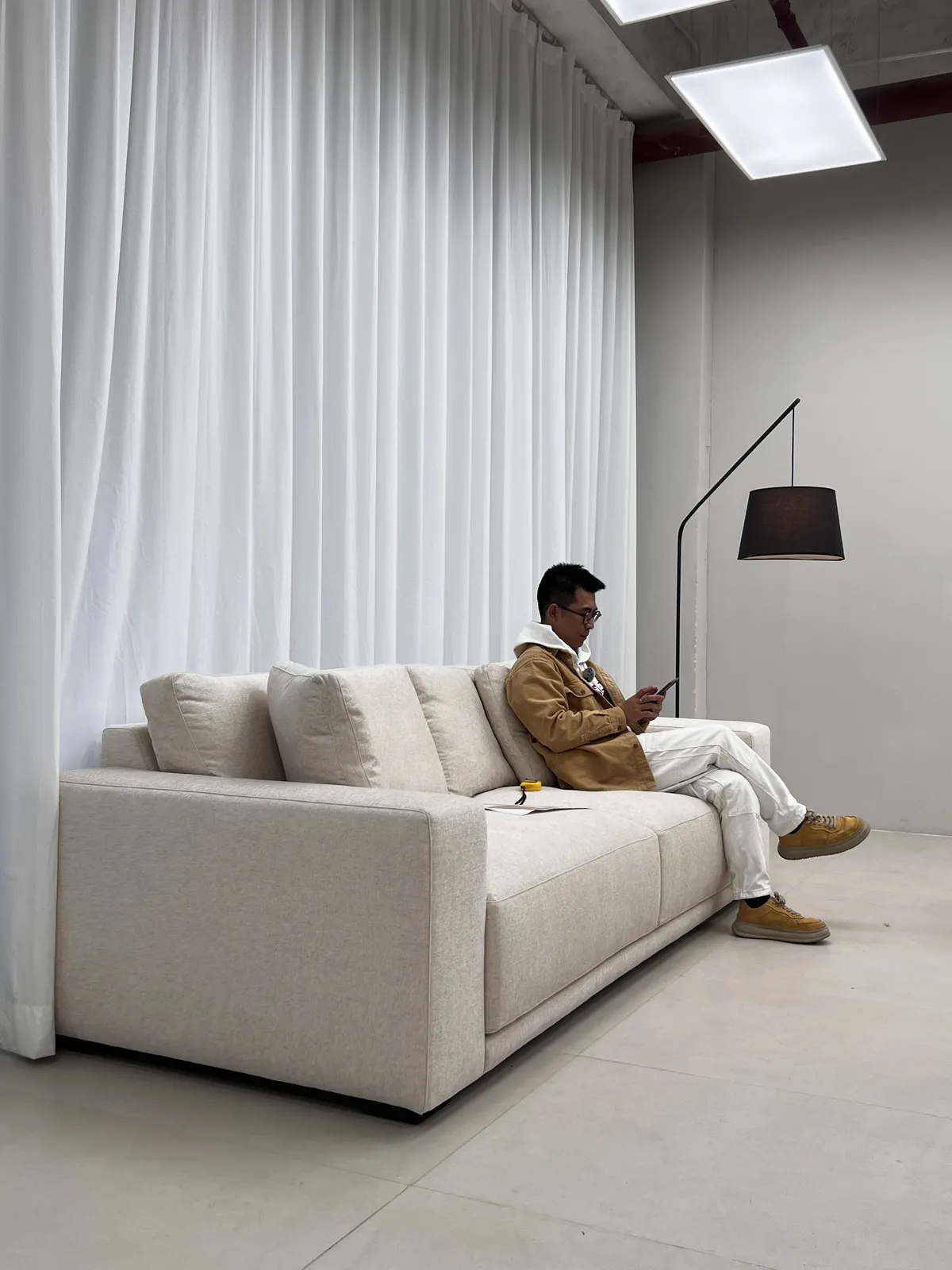 Sit test on a finished sofa in the inspection studio