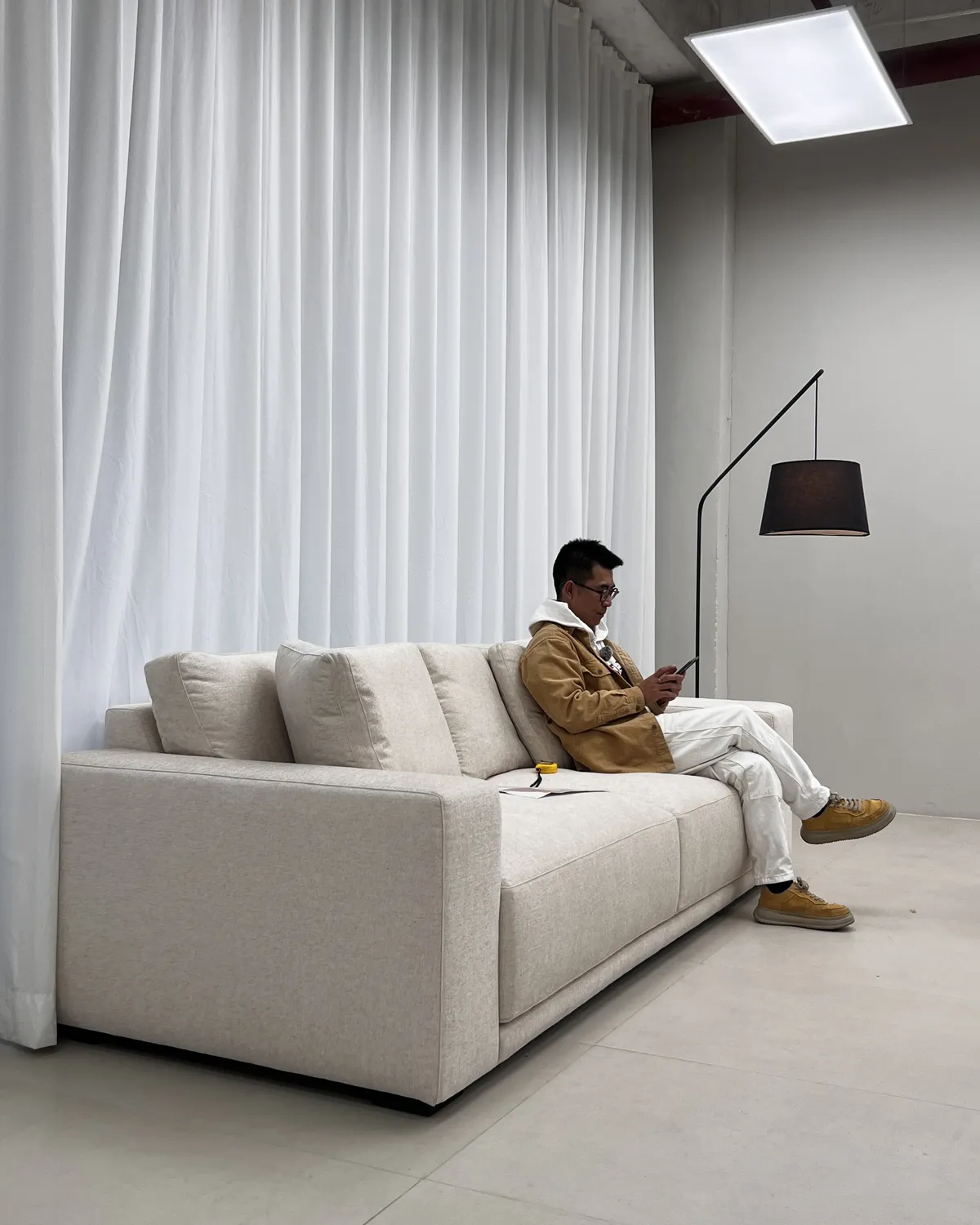 Sit test on a finished sofa in the inspection studio