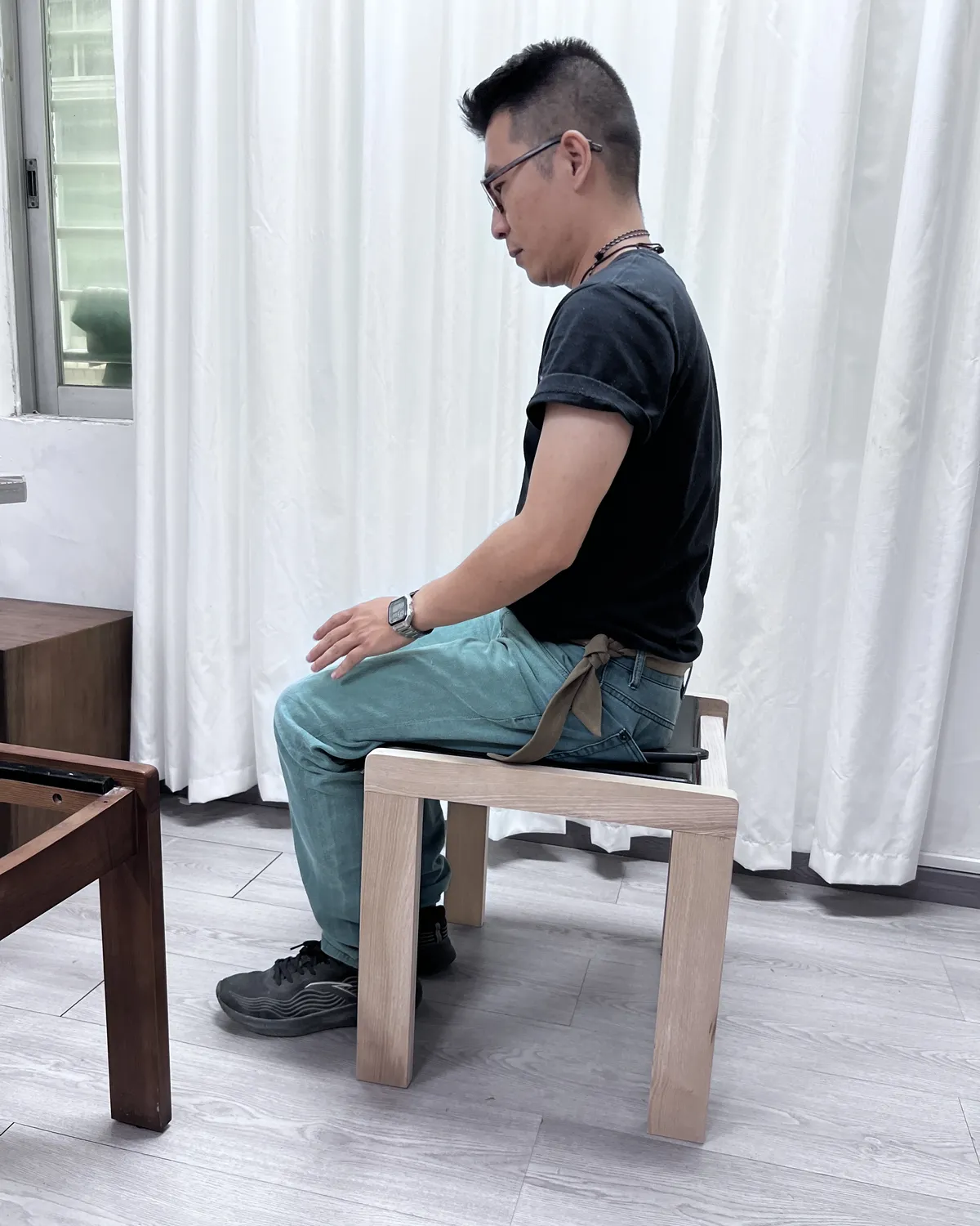 Inspector sitting on a stool to check stability