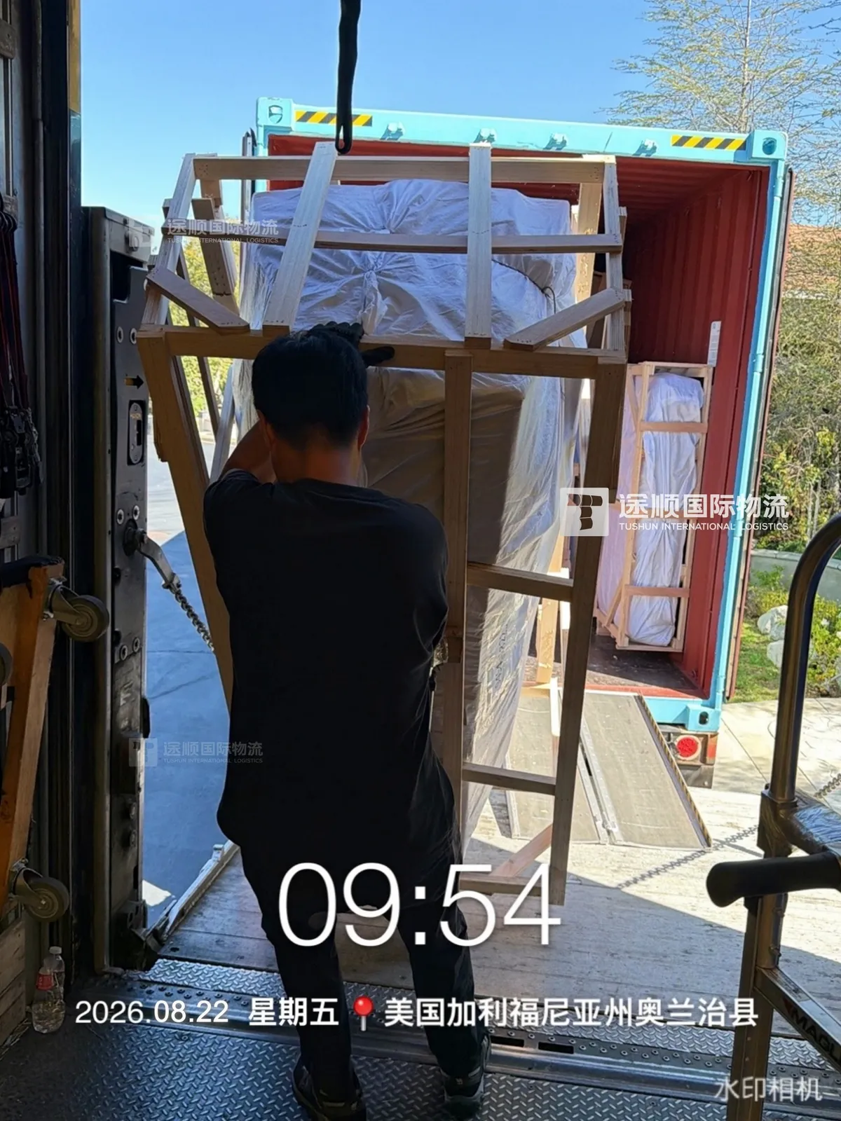 Crated piece carried down the container ramp