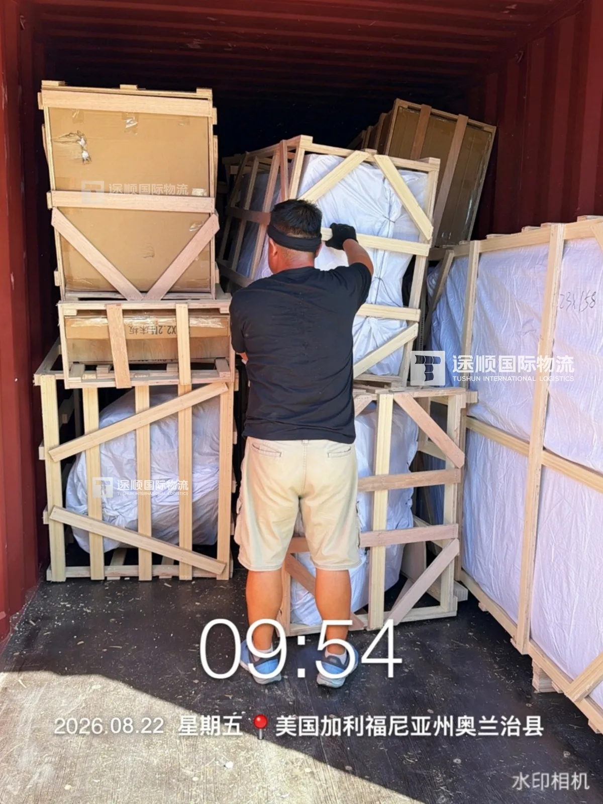 Timber crates inside the shipping container on arrival
