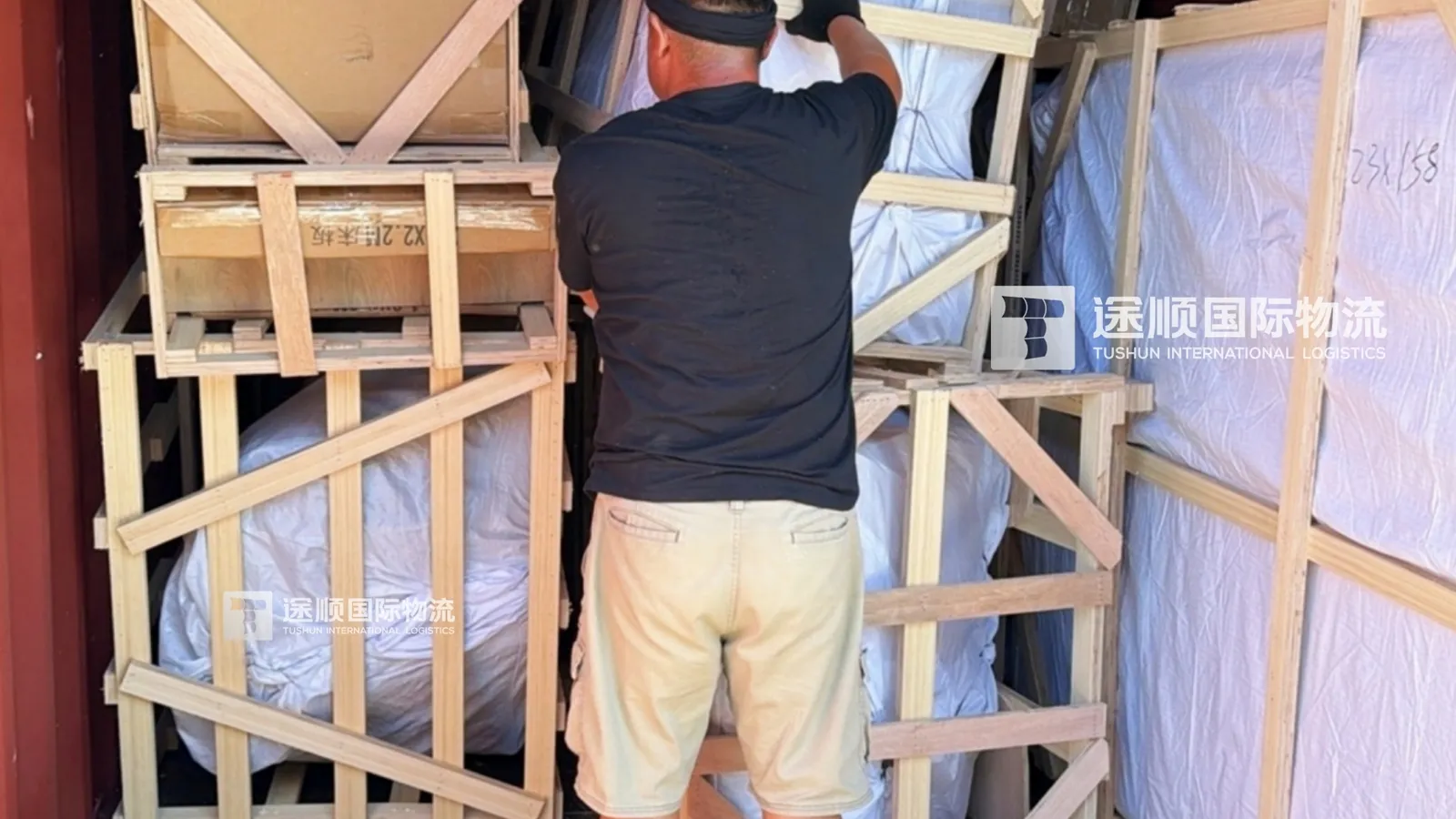 Timber crates inside the shipping container on arrival